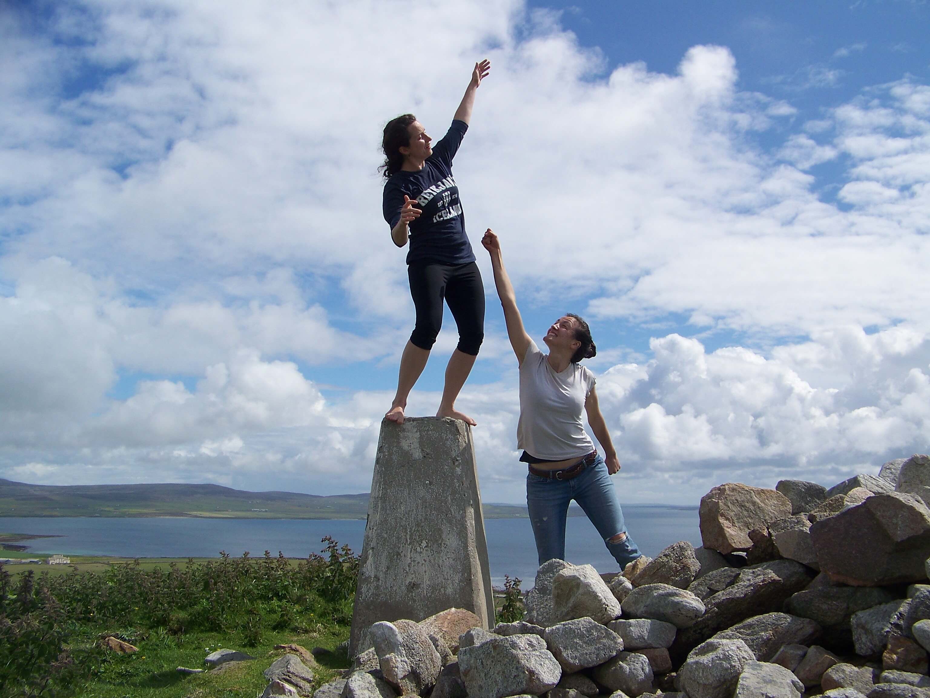 Sarah and Bridgett, two of Rhonda's daughters Girls on the trig point atop the brae Stromness, Orkney