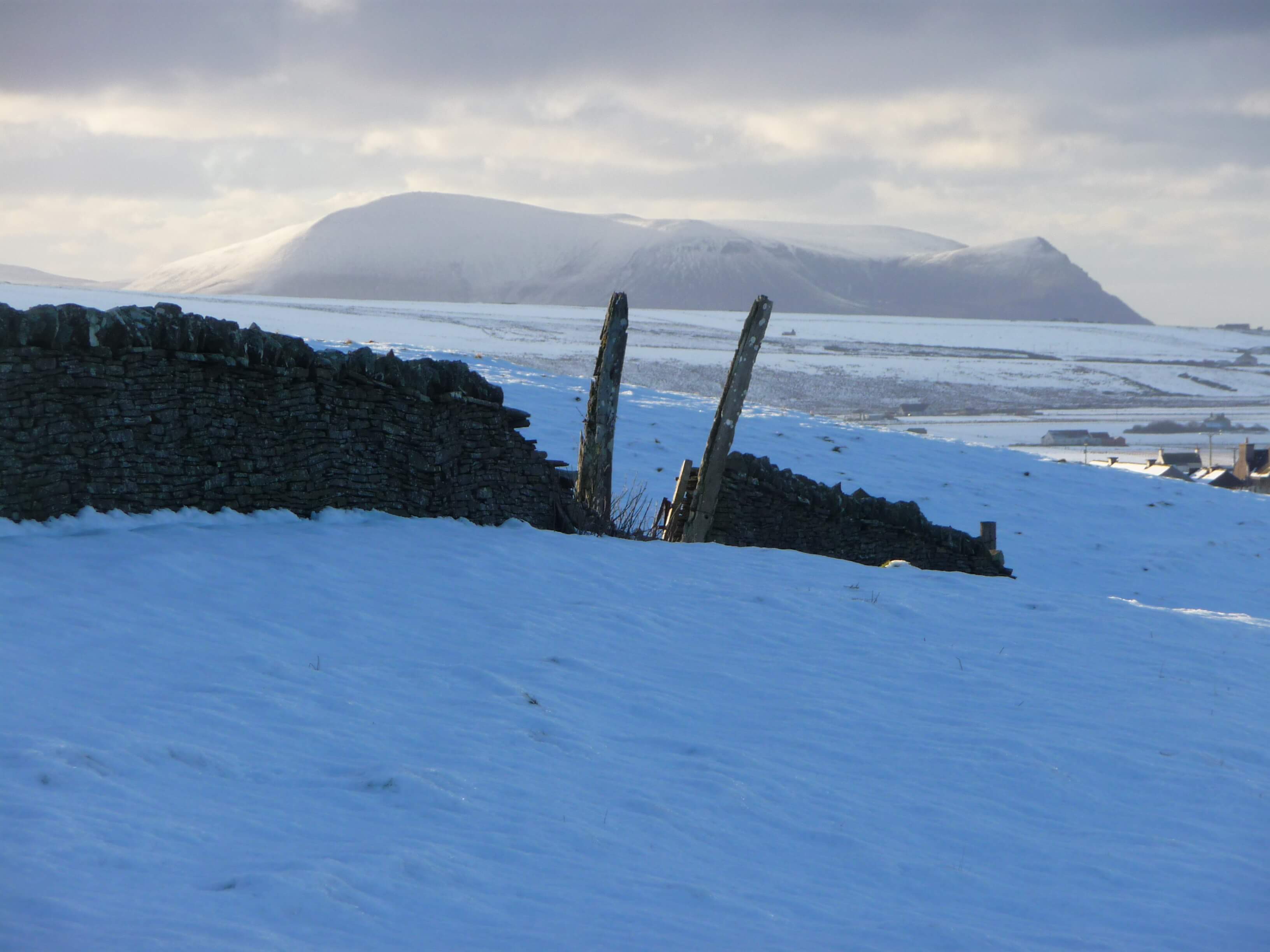 The haunting hills of Hoy in the distance Whale bone arch, Firth, Orkney, Scotland