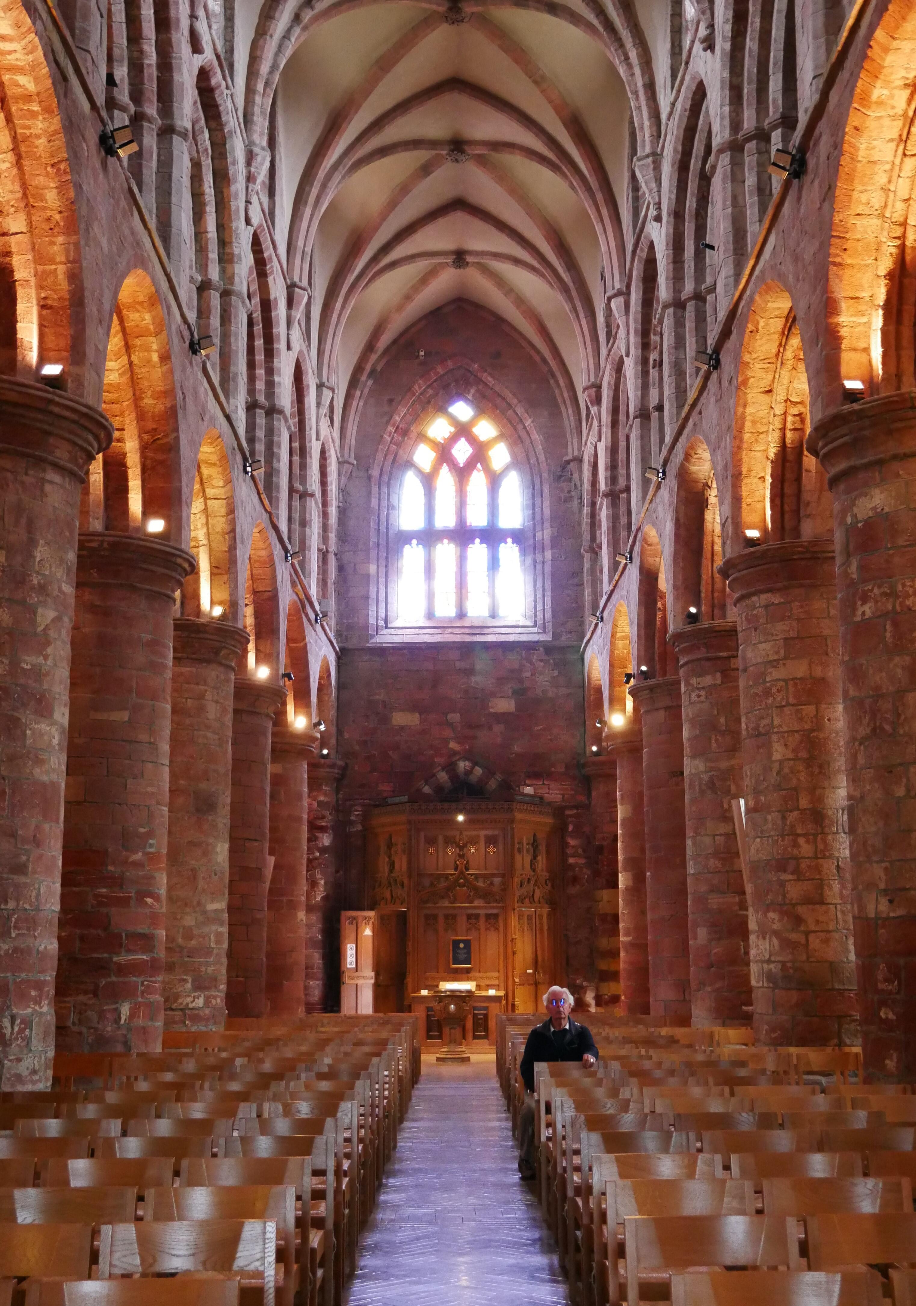 A place for quiet reflection A man reflects quietly in Kirkwall's cathedral - Orkney Islands, Scotland, UK