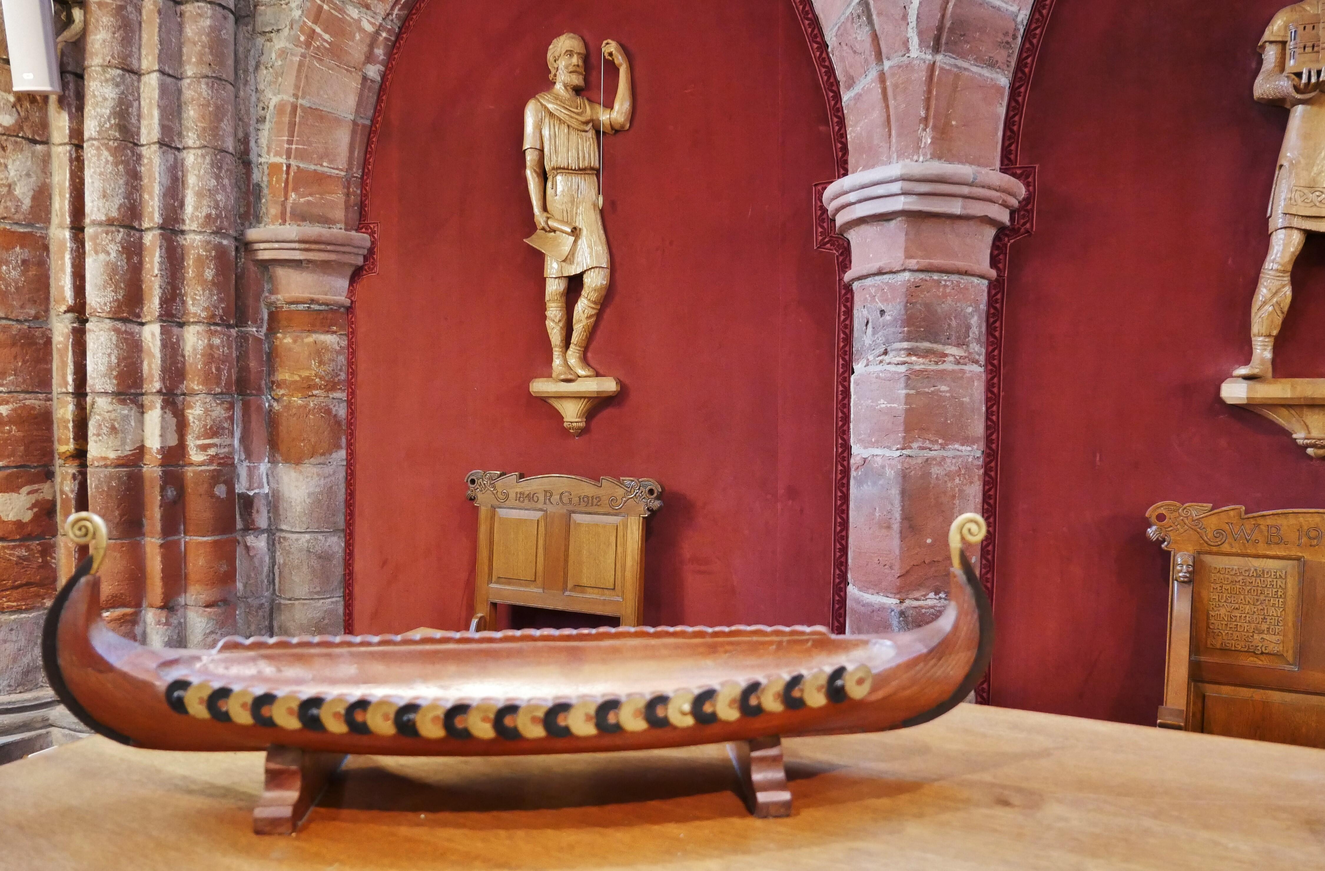 Carved representation of Kol Kalisson, St Rognavald's father who oversaw the early building of the cathedral. See our Secrets of St Magnus Cathedral page to find out who the famous model was. Carved representation of Kol Kalisson, St Rognavald's father who oversaw the early building of the cathedral, Kirkwall, Orkney, Scotland, UK