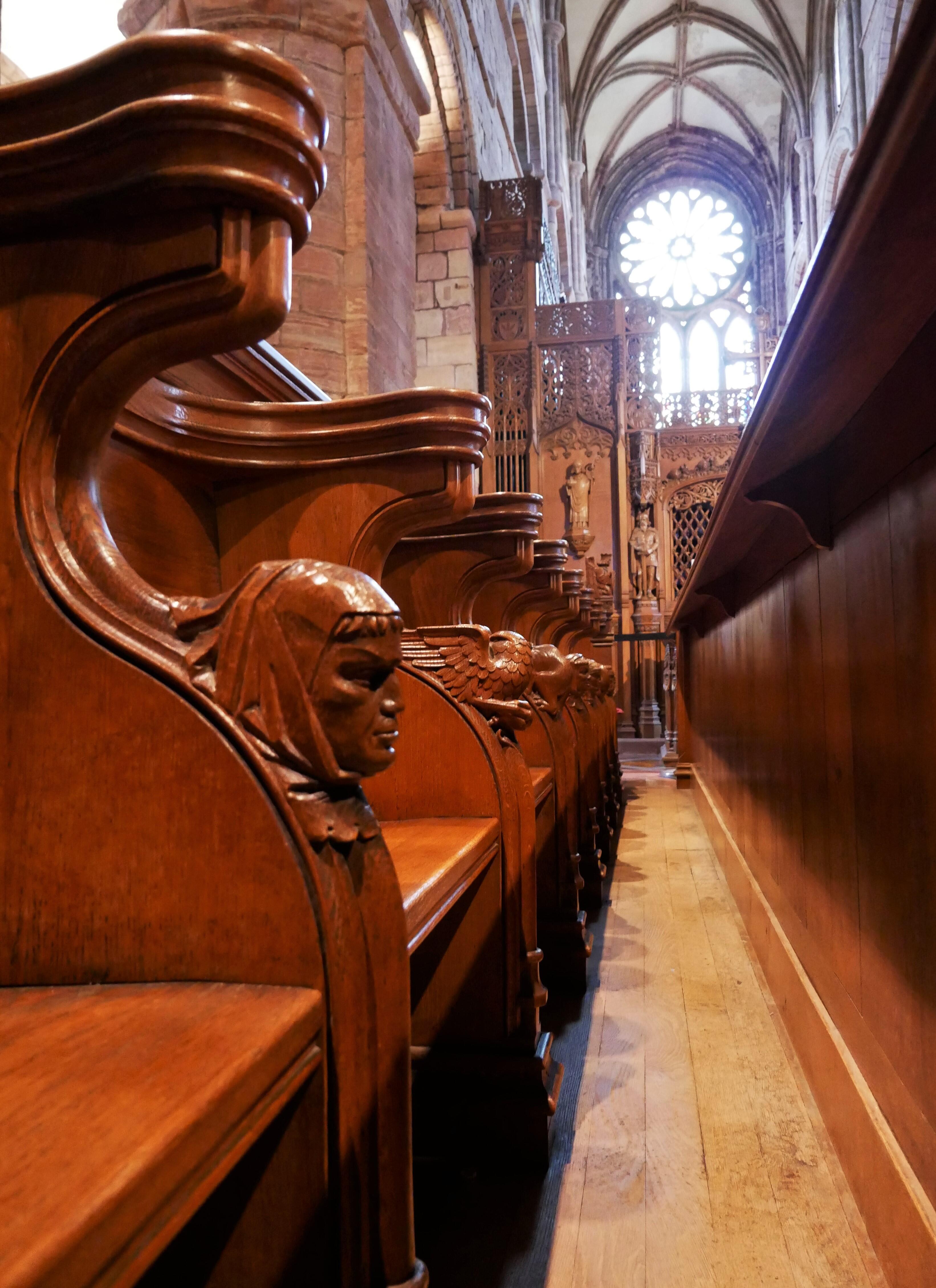 Wooden figures on the cathedral's pews - Kirkwall, Orkney Islands, Scotland, UK