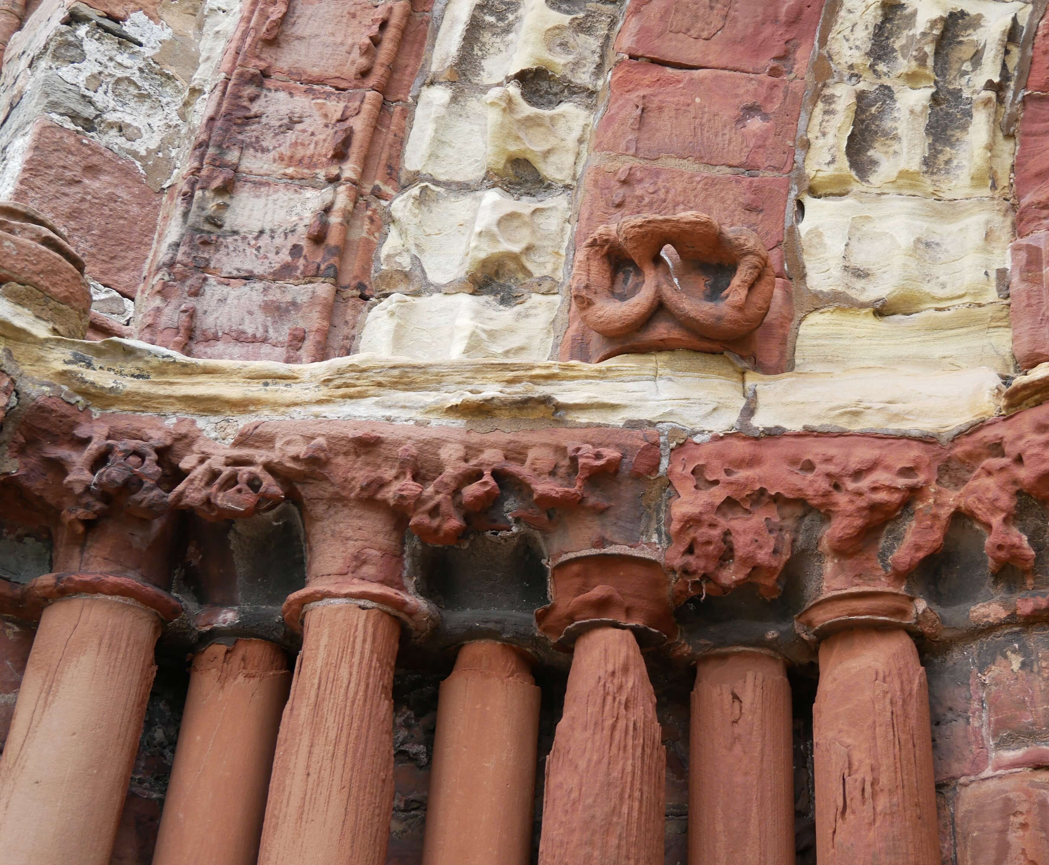 Wind-blasted pillars at entrance Wind-blasted sandstone pillars guard the entrance to the cathedral - Kirkwall, Orkney Islands, Scotland, UK
