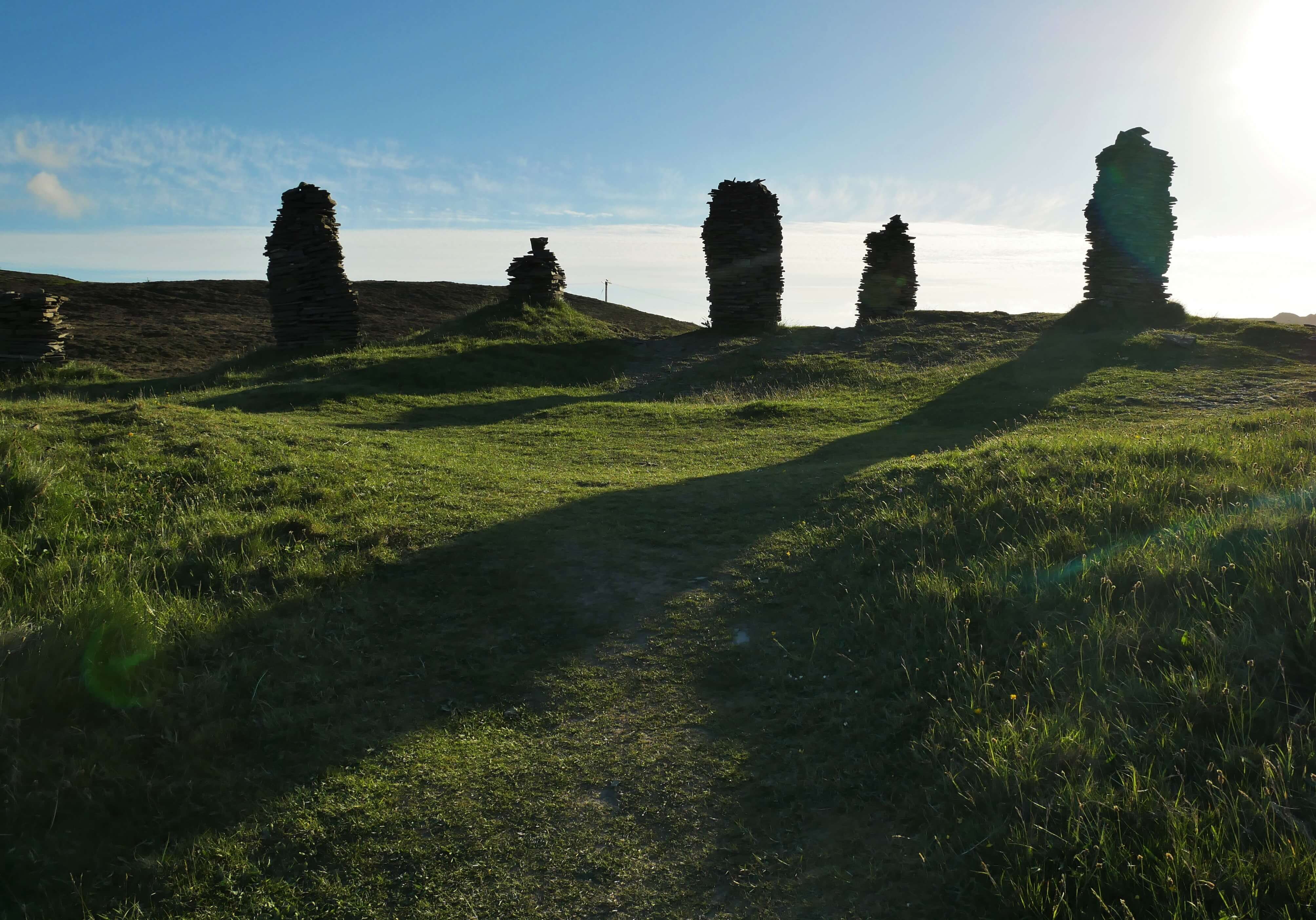 Modern stone builders make cairns above the cairn, Finstown, Orkney, Scotland