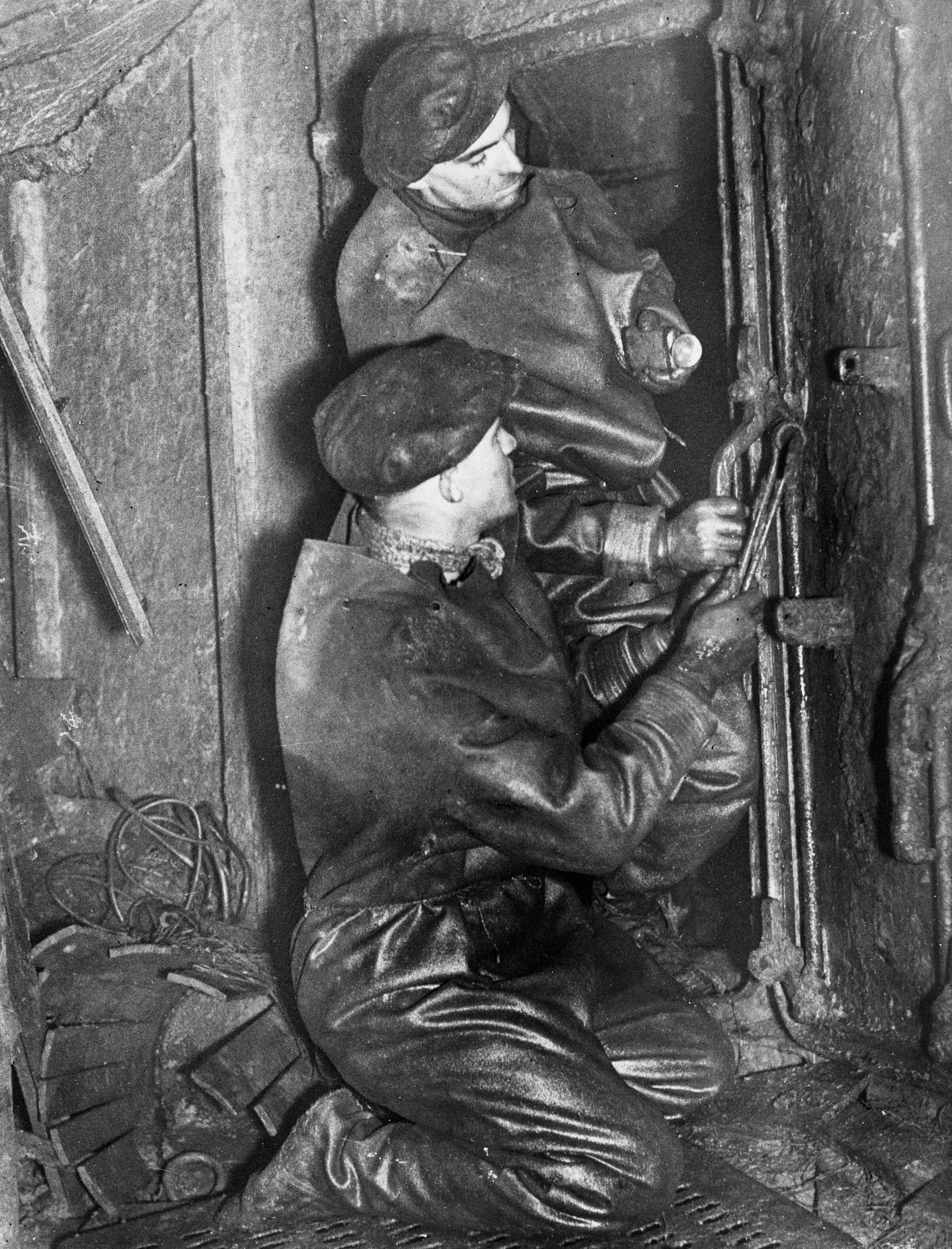 Salvage work on upside-down German ships after WWI scuttling of German High Seas Fleet in Orkney's Scapa Flow, Scotland
