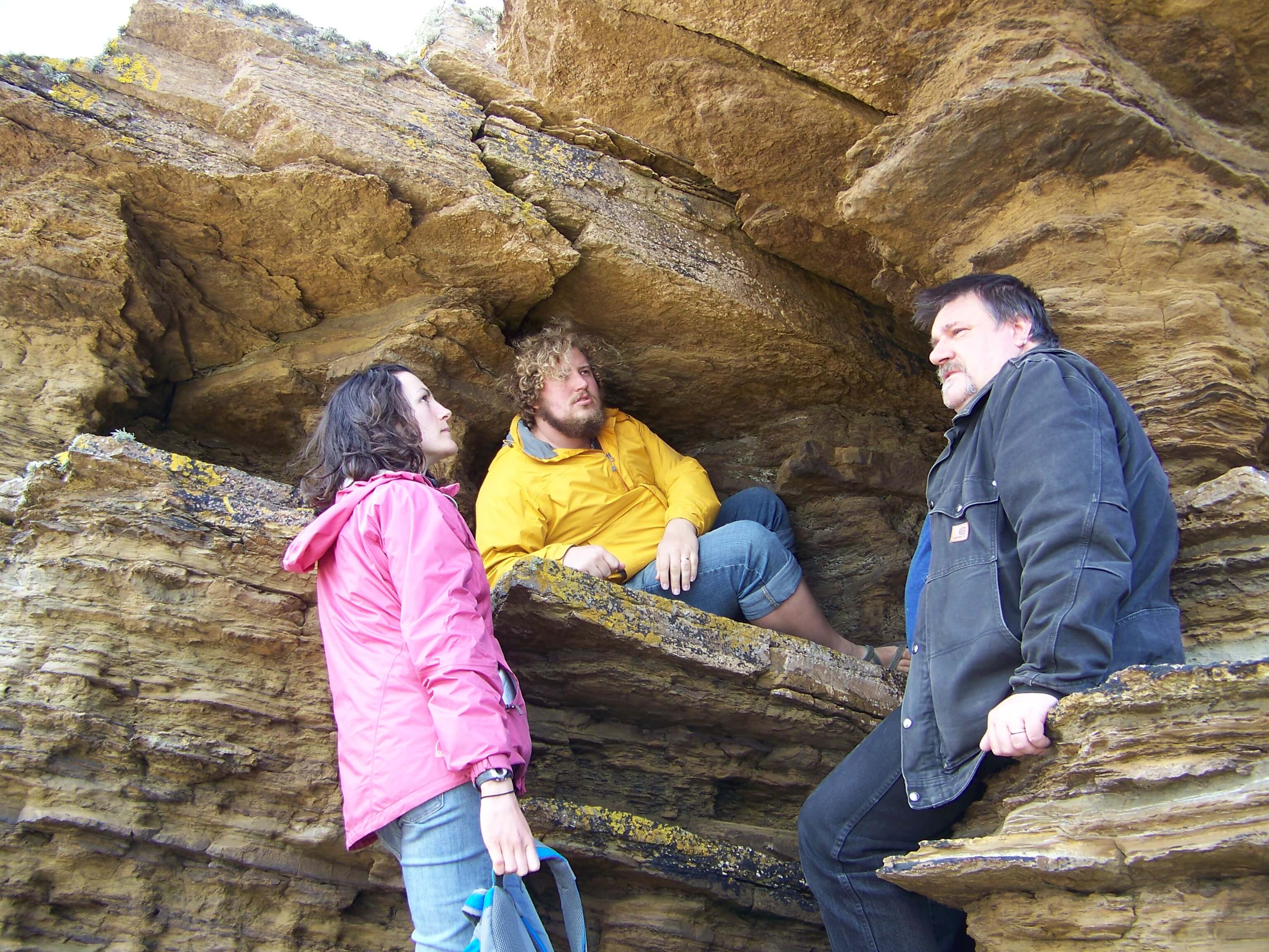 Bridgett and Dan listen to Tom's harrowing tale about press gangs Storytelling on a beach in Orkney