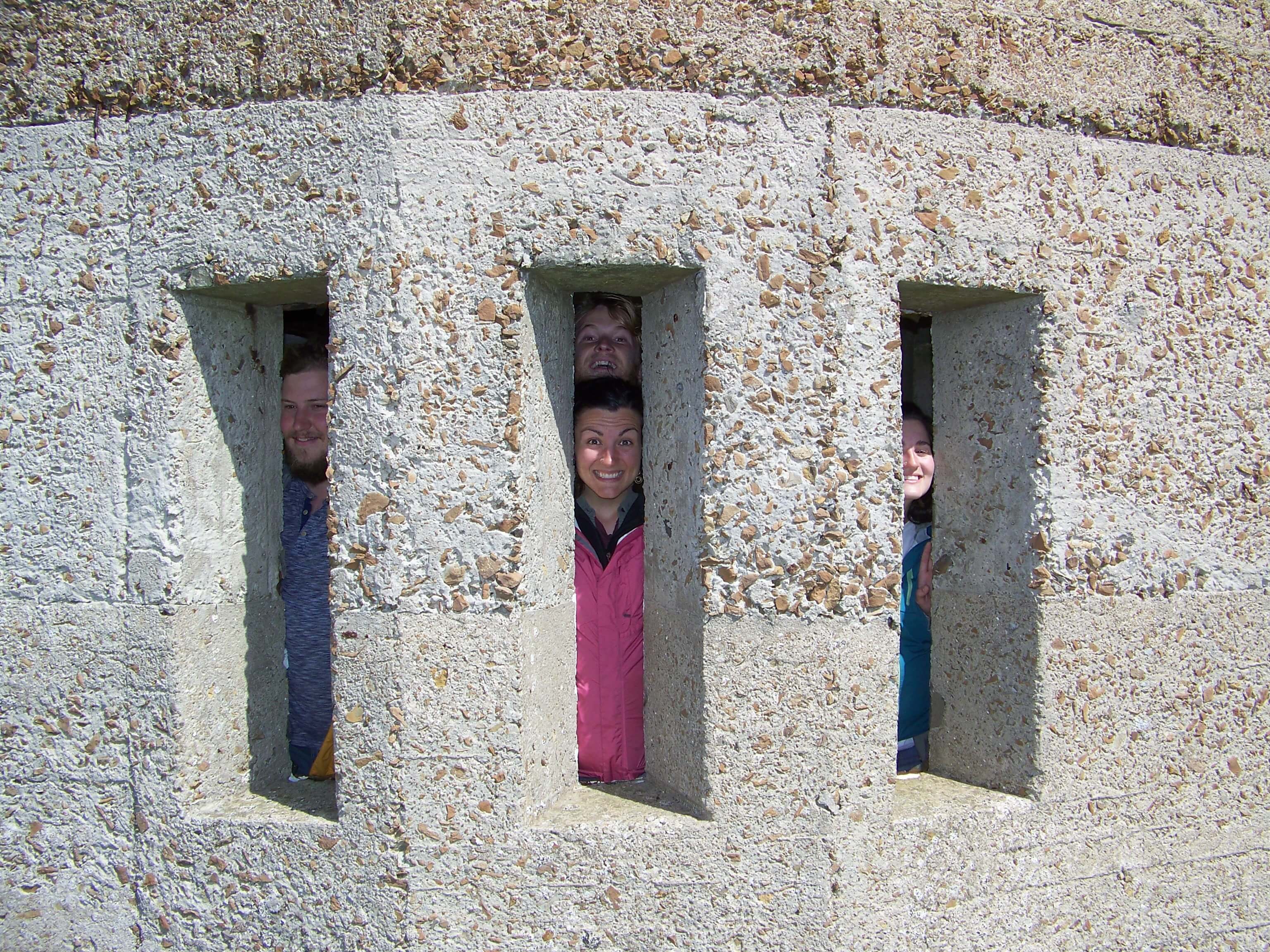 Getting a sea view from the battery Looking out from WWII battery remains, Orkney