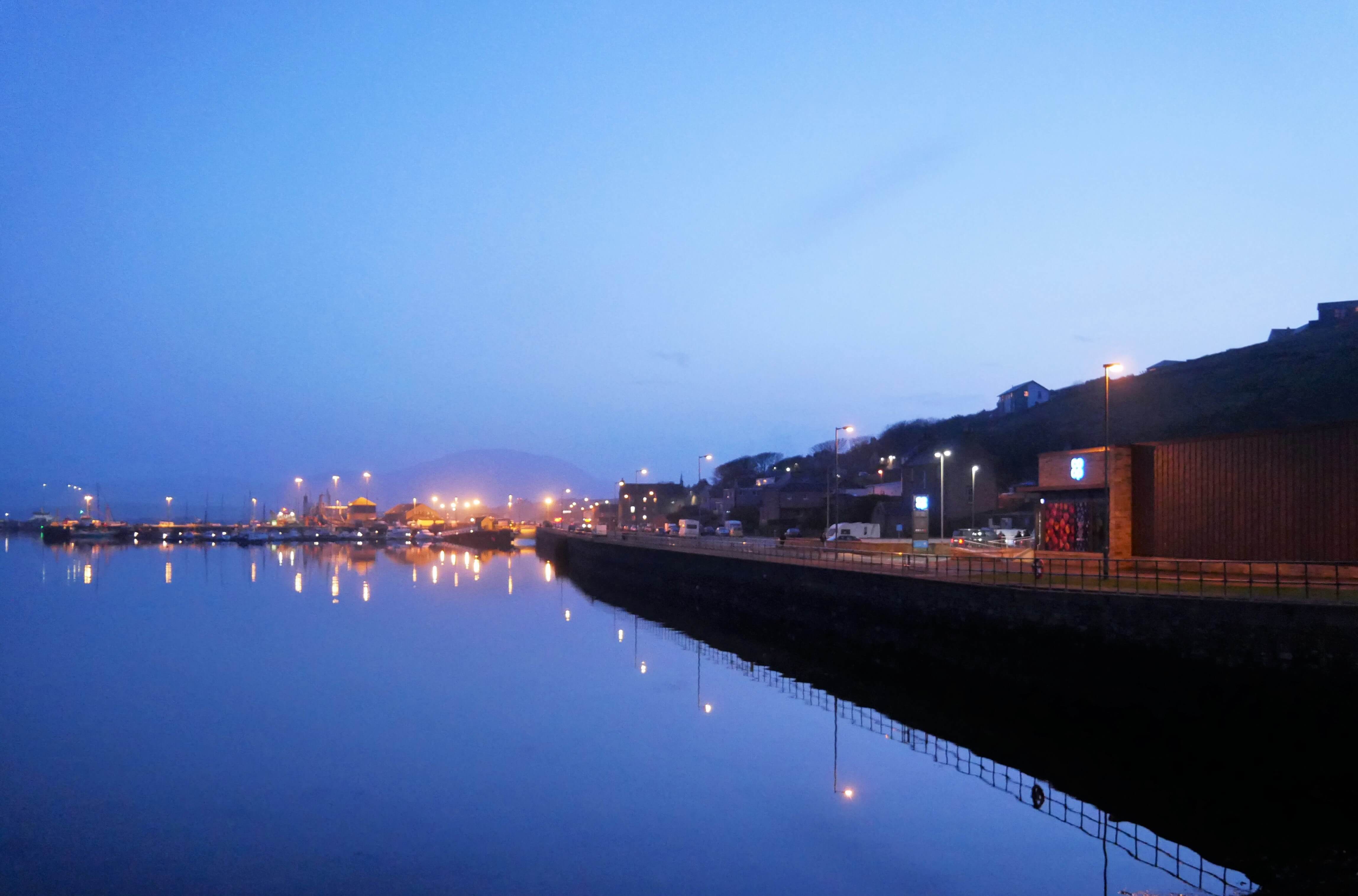 Evening view of Stromness, Orkney Islands, and the hills of Hoy, Scotland, UK