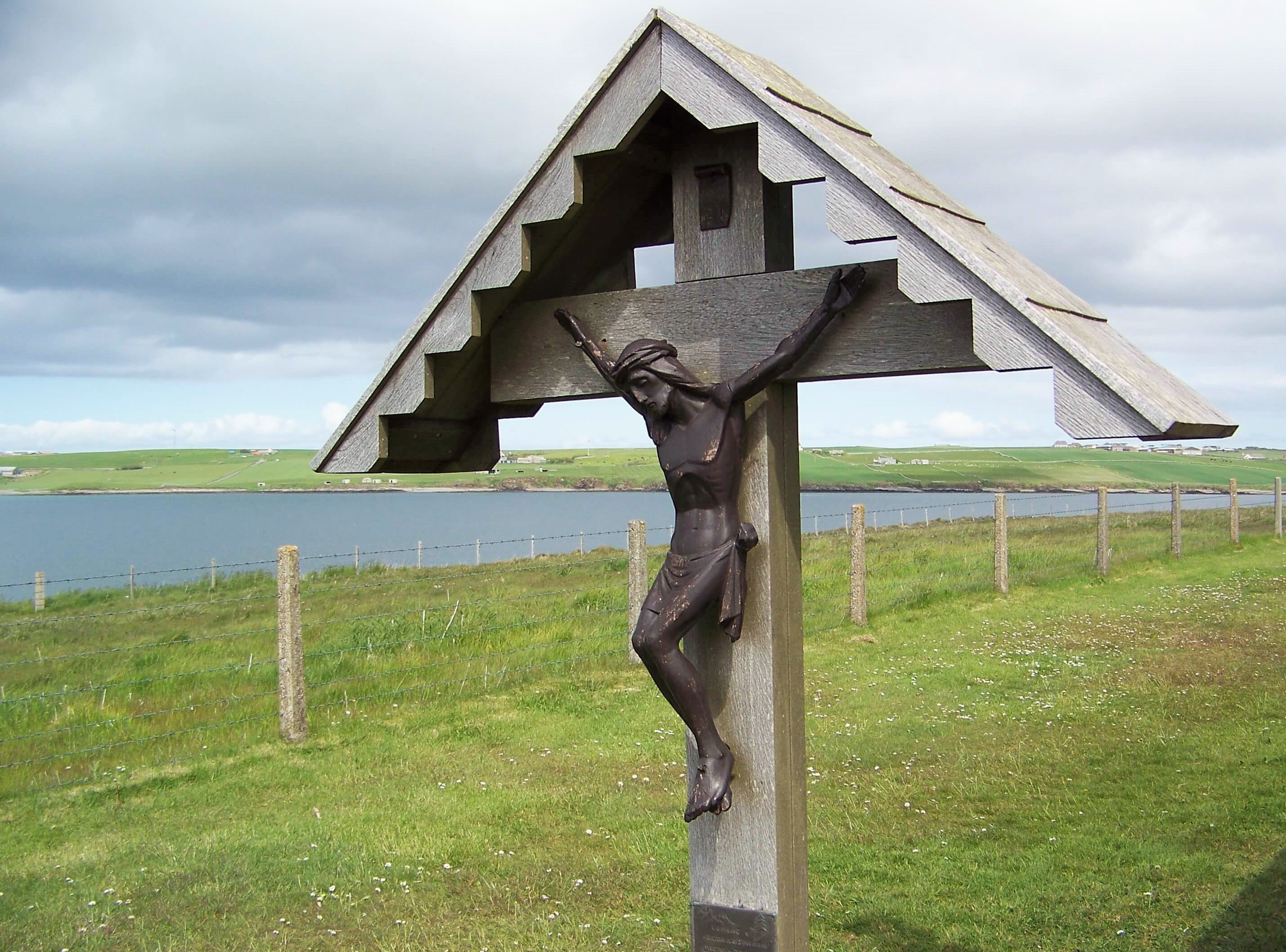 The older Christ figure that once stood outside the chapel The chapel at Lamb Holm, Orkney Islands, Scotland. Built by Italian POWs in WWII. www.Orkneyology.com