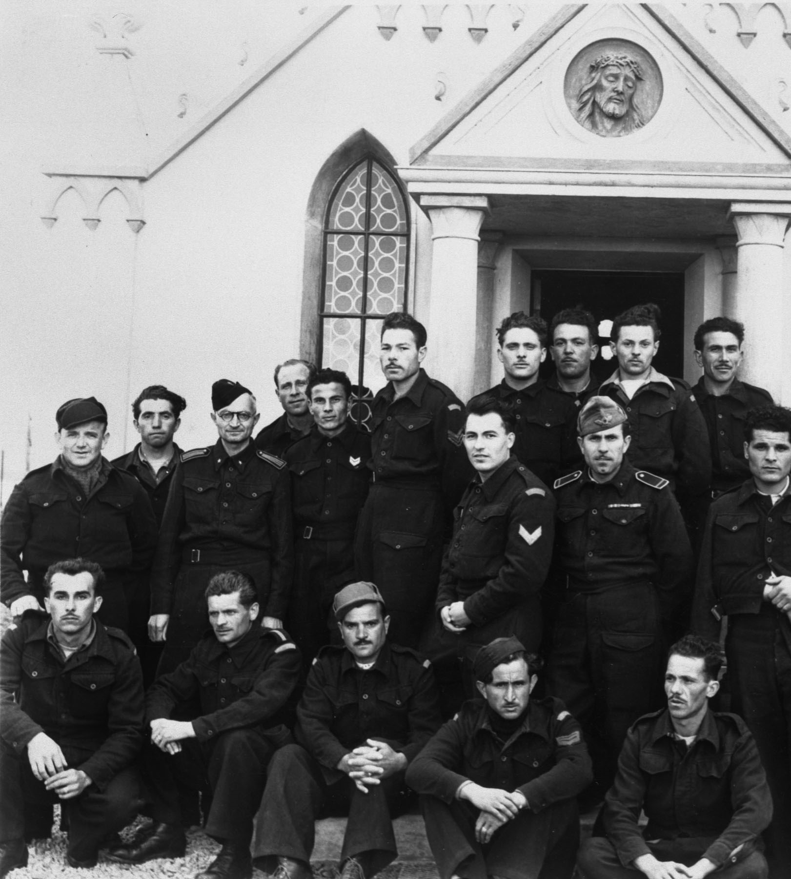 Chiochetti is in the back, far left. Palumbi is the man standing in front of the left pillar. Camp life on Lamb's Holm for Italian POWs in the Orkney Islands, Scotland. www.Orkneyology.com