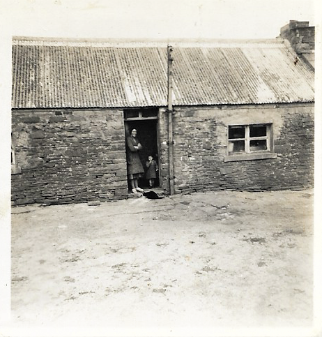 Elizabeth Muir in the doorway of the farm of Valdigar, Tankerness, Orkney Islands, Scotland. www.orkneyology.com