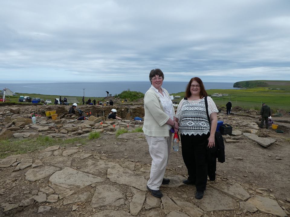 Local Orkney expert, tour guide Jo Jones with Lynne Jungman [USA] at the Cairns Dig, South Ronaldsay, 2017. Find more local experts on Orkneyology.com.
