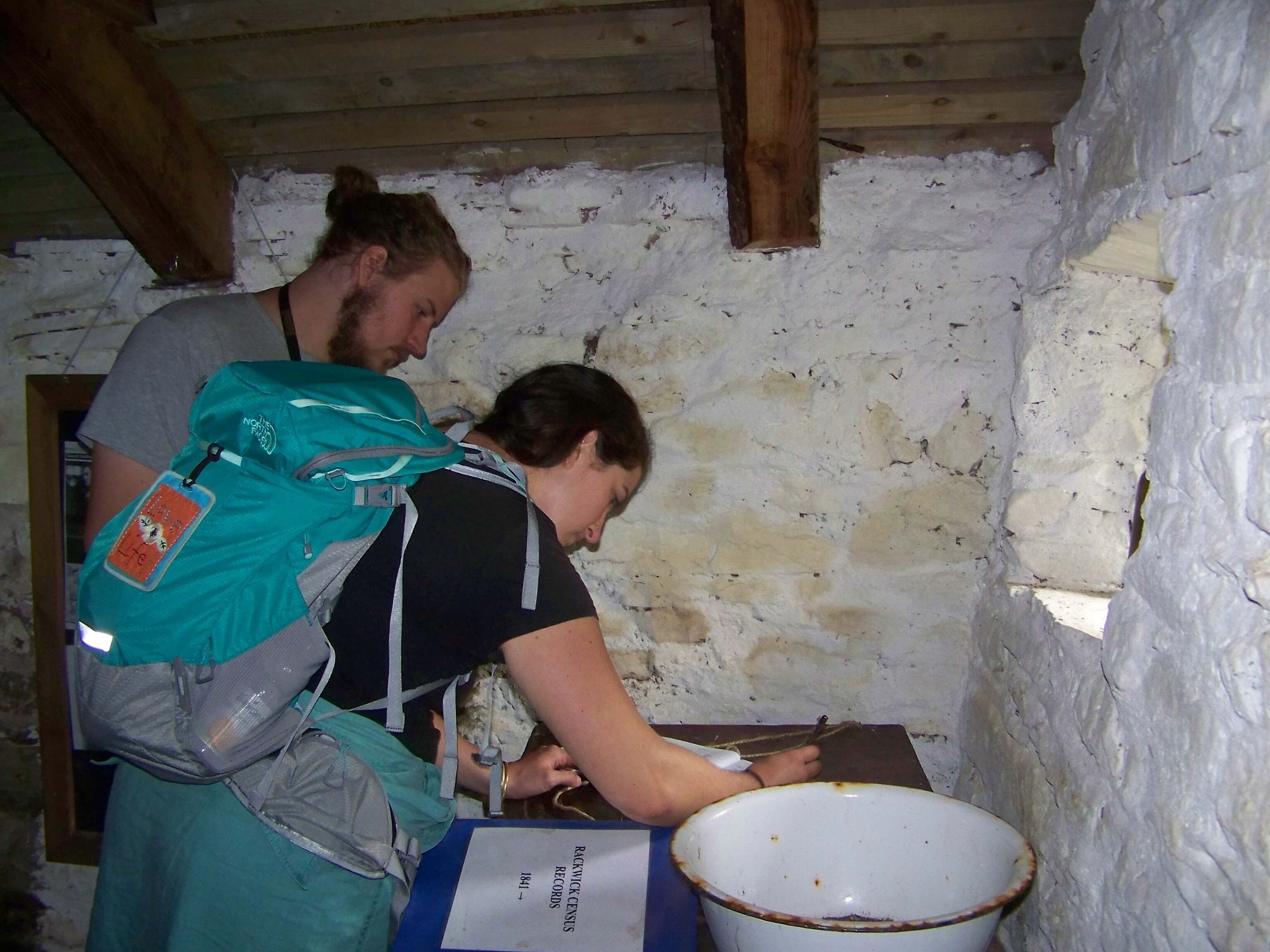 Visitors sign a guest book in the Craa's Nest Museum, Hoy, Orkney