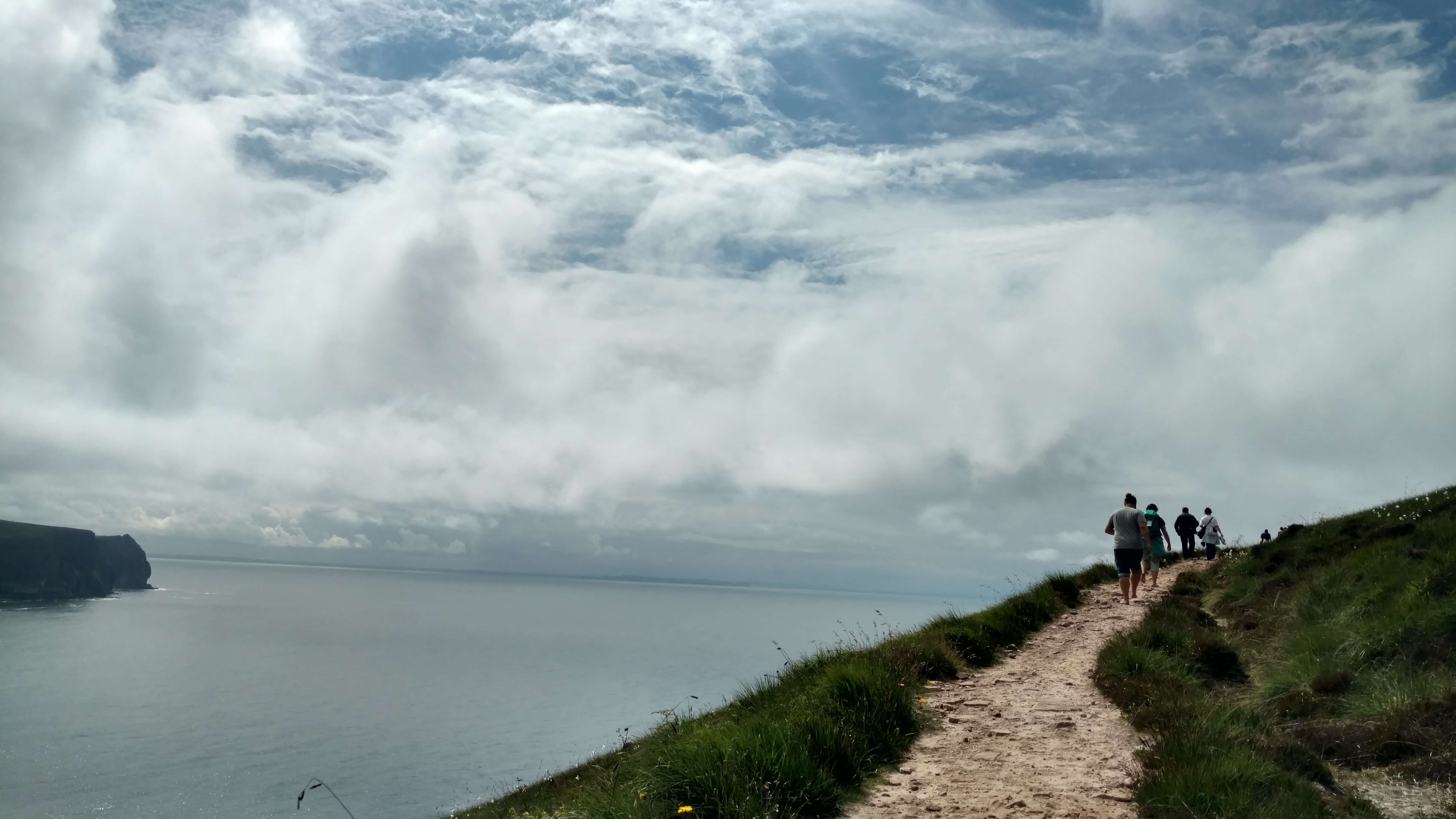 Visitors climbing the path leading to the Old Man of Hoy