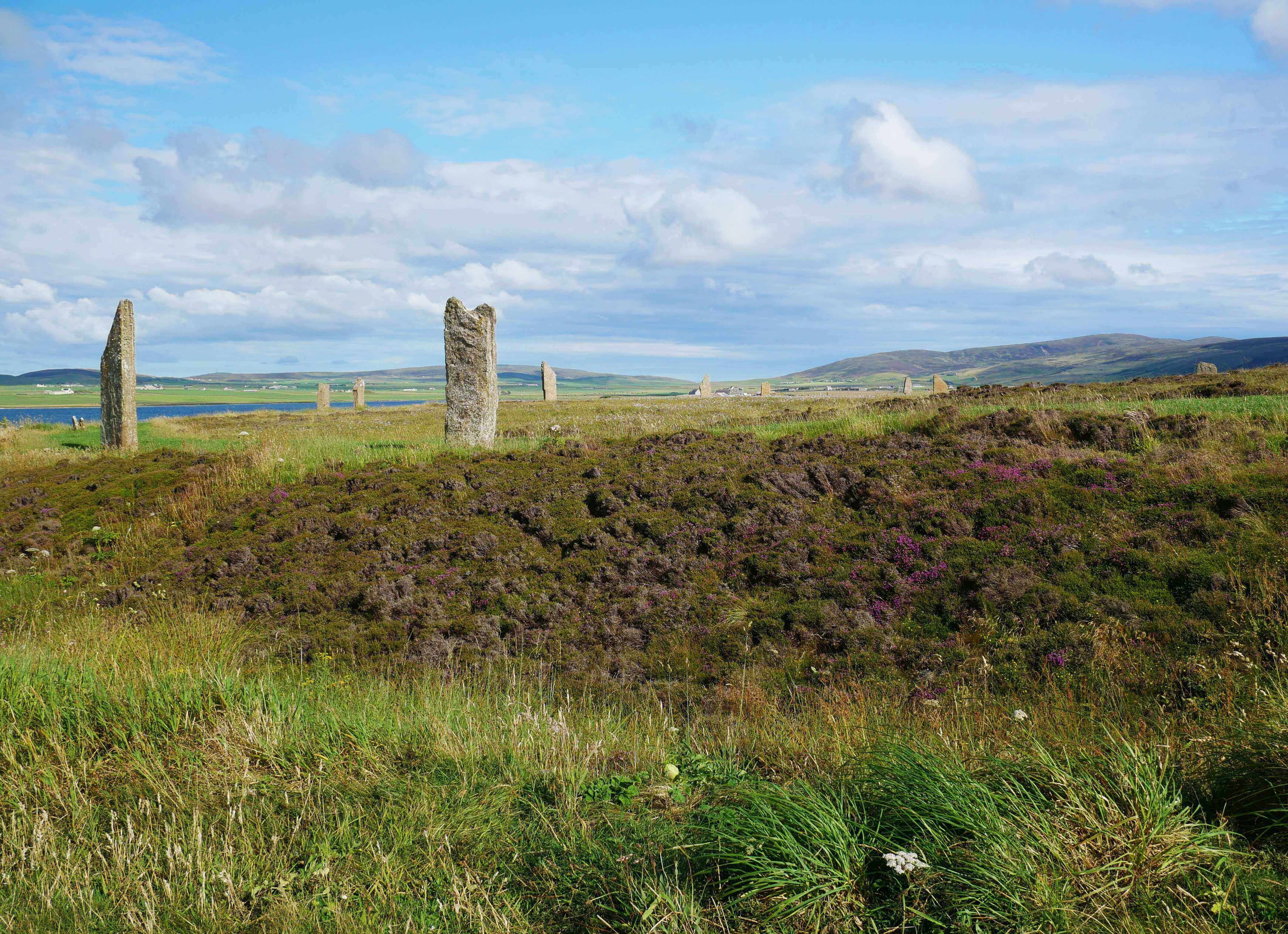 Hilly terrain surrounds the ring Hilly terrain surrounds the standing stone circle at Brodgar.  Orkney Islands, Scotland, UK. www.orkneyology.com