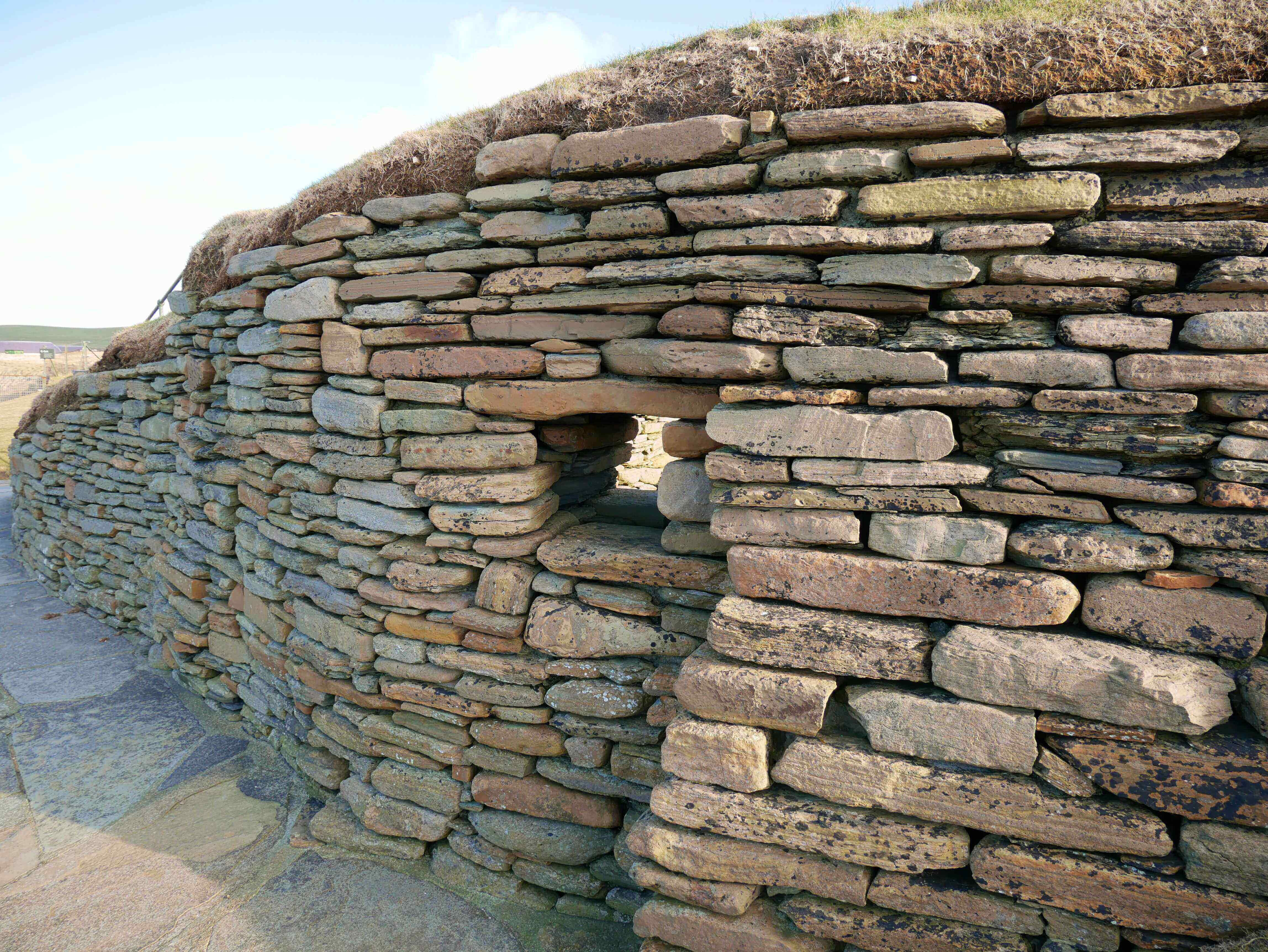 The outside wall, originally covered in earth Neolithic Village found on Skaill Beach, Sandwick, Orkney Islands, Scotland, UK. #Orkneyology.com