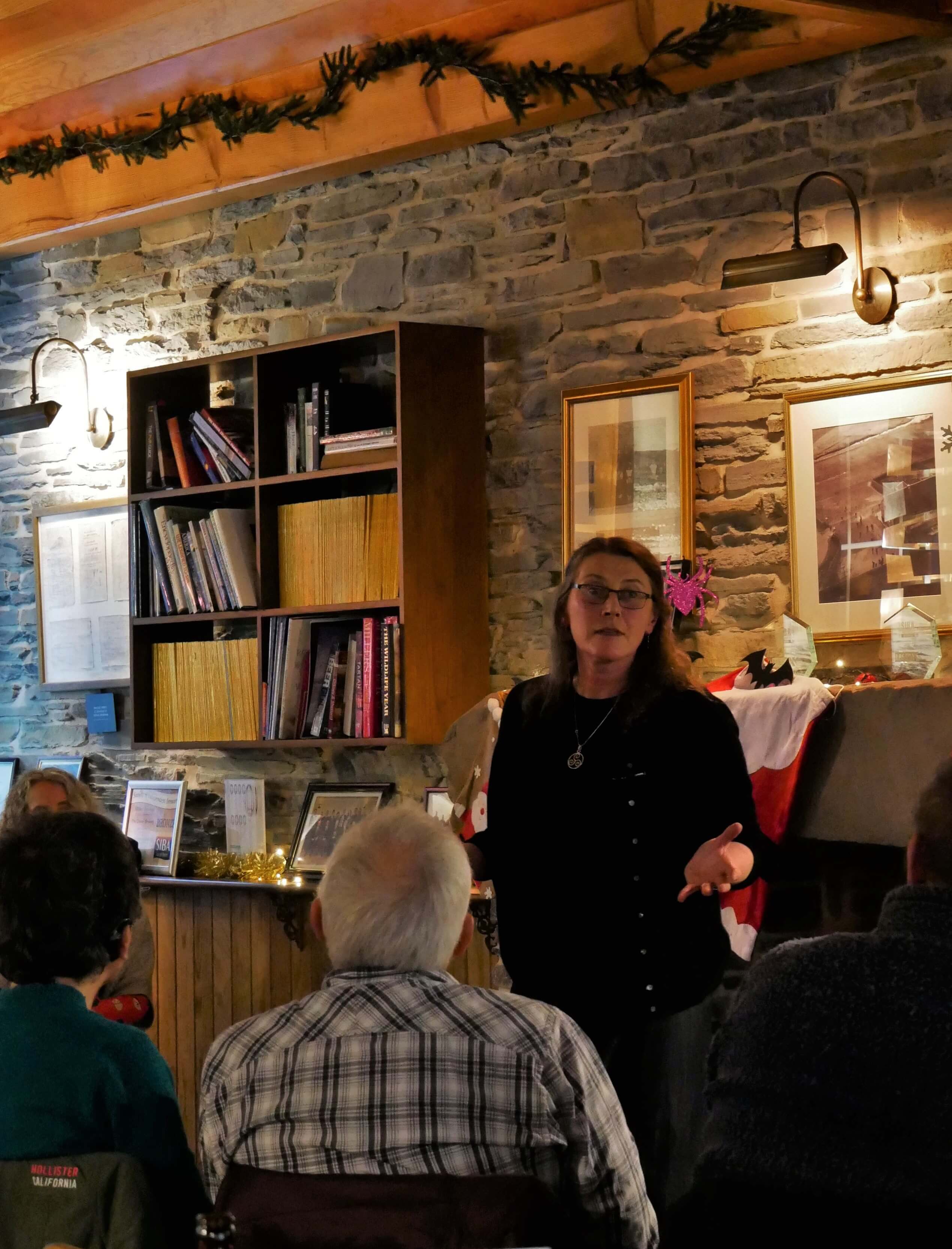 Aine King tells a chilling ghost story for Christmas at The Orkney Brewery Storyteller and artist, Aine King of Highland Park House, Kirkwall, Orkney, telling a Christmas ghost story at The Orkney Brewery.