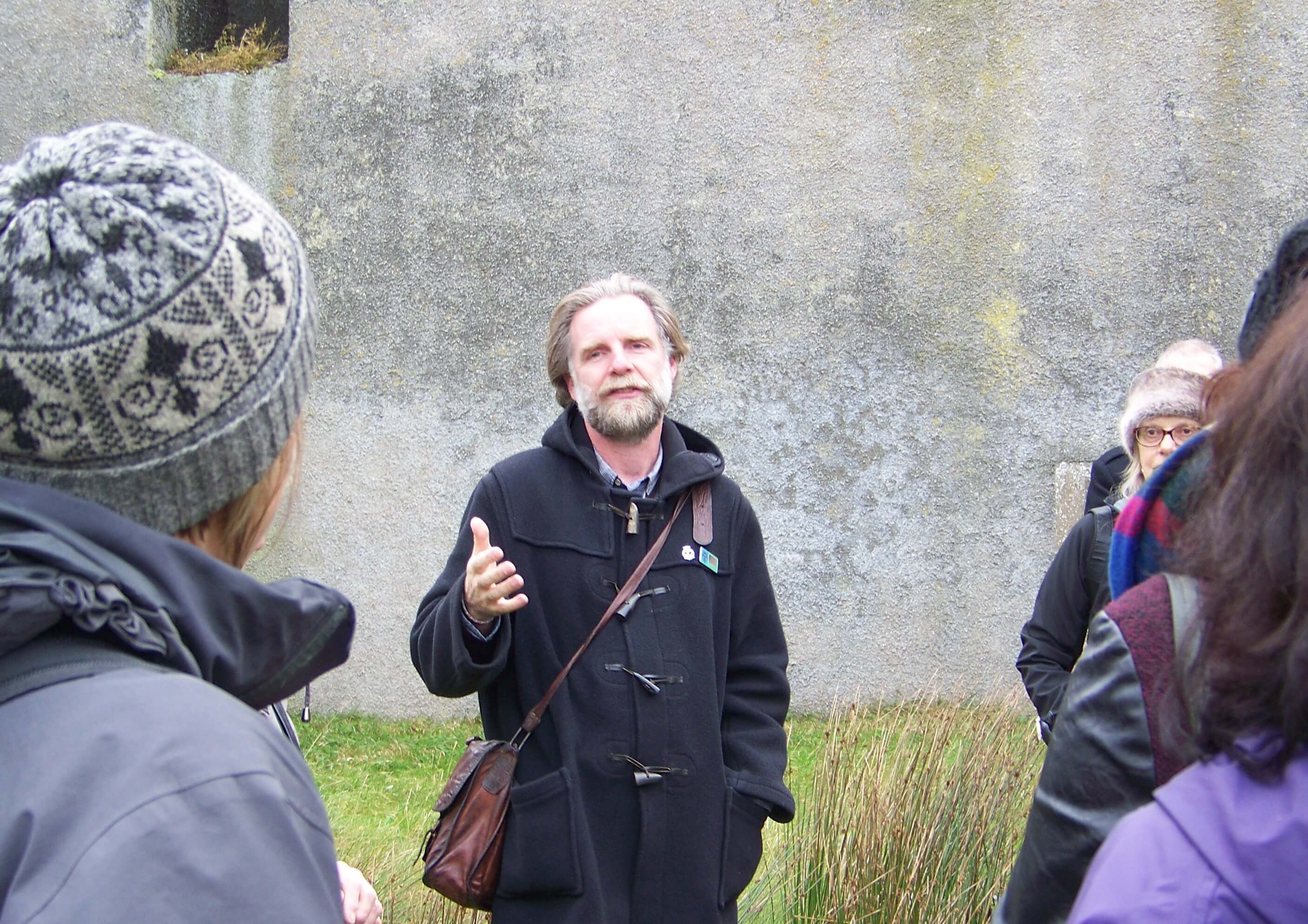 Andrew Hollinrake, Orkney tour guide giving a WW II battery tour on Flotta, Orkney Islands, Scotland, UK