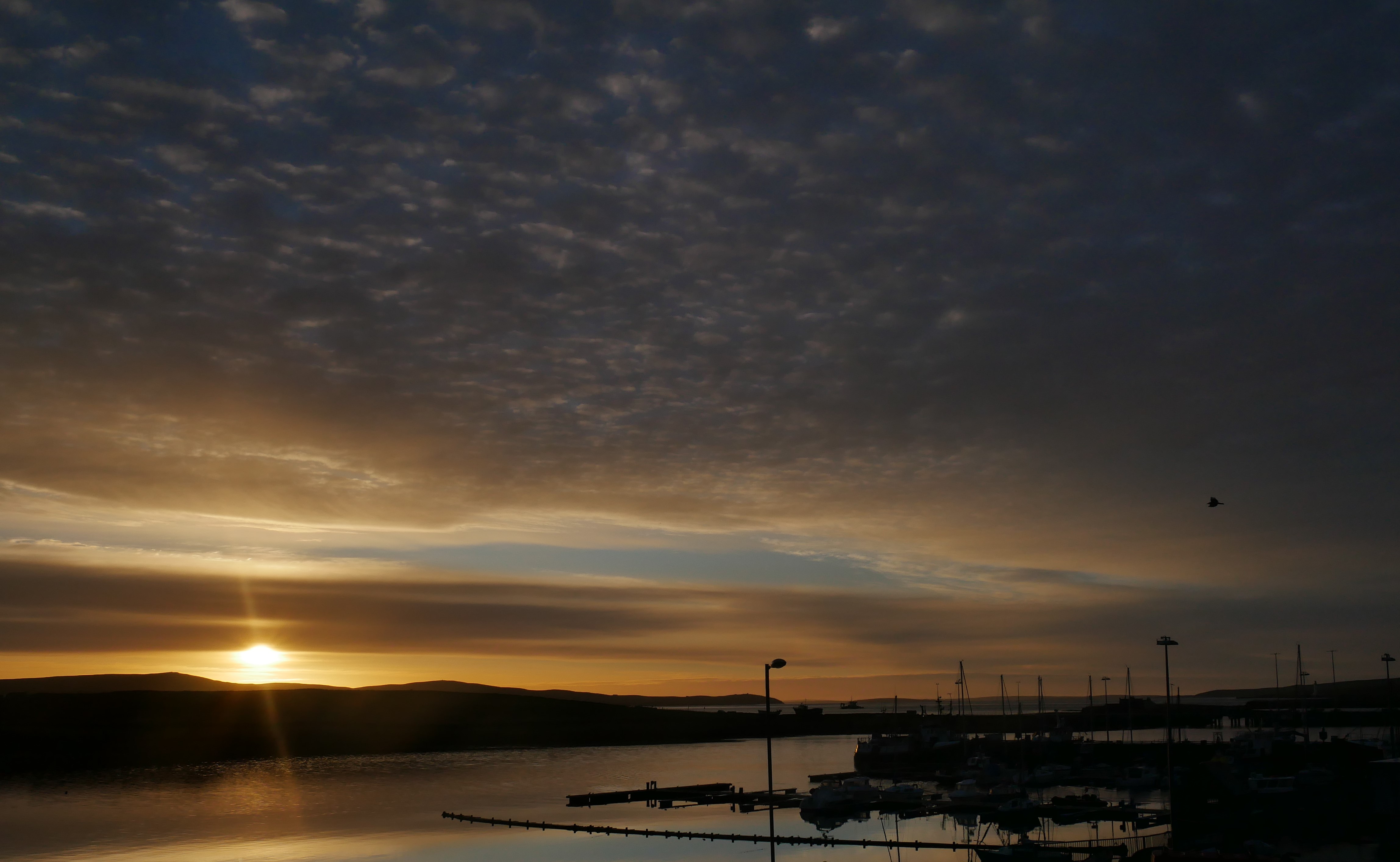 Sunrise over a peaceful harbor, Stromness Stromness harbor, Orkney Islands, Scotland, UK