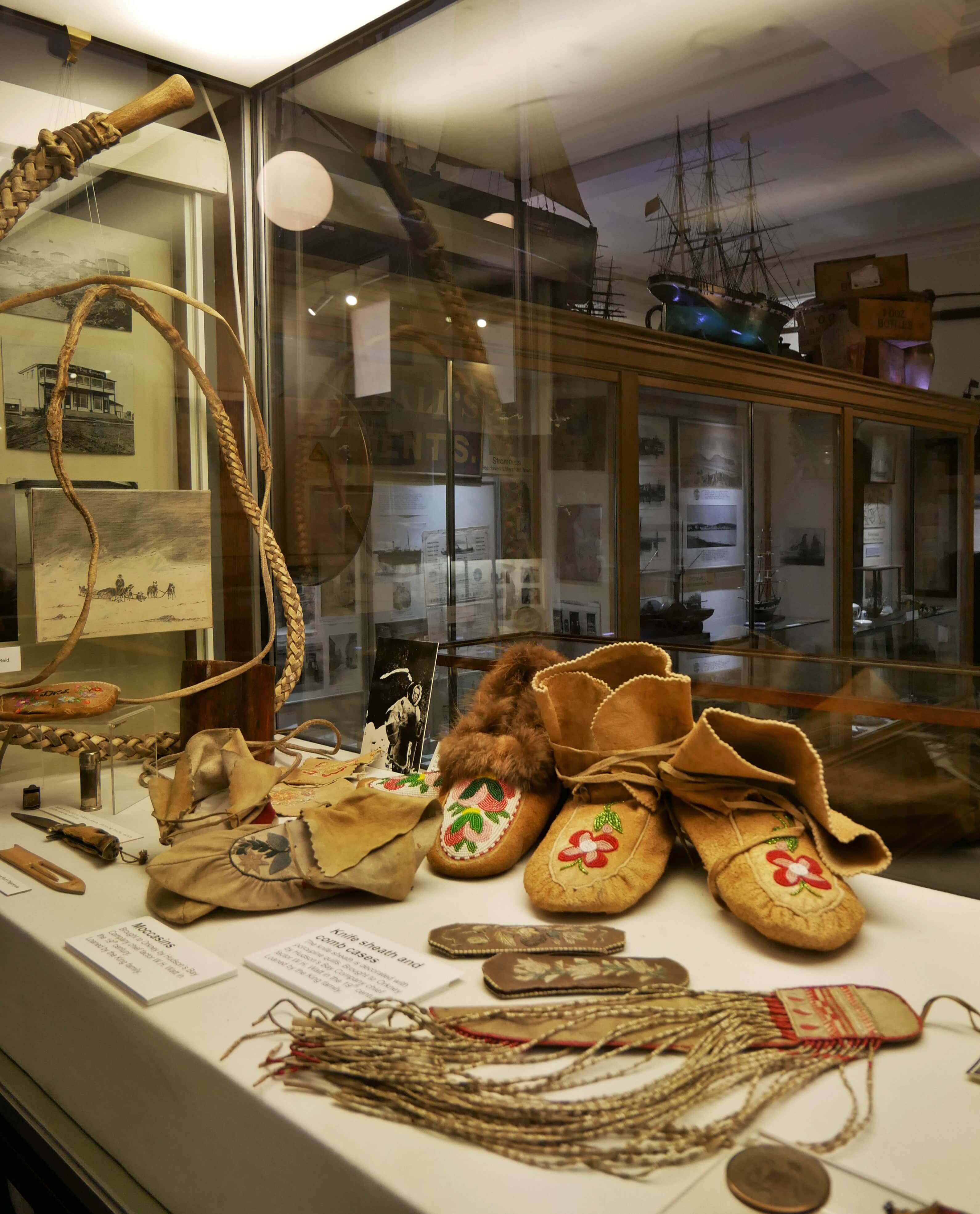 Among many other interesting things, you can see First Nations and Inuit artefacts in Stromness museum. Artefacts from the Hudson's Bay Company in the Stromness Museum, Stromness, Orkney Islands, Scotland, UK