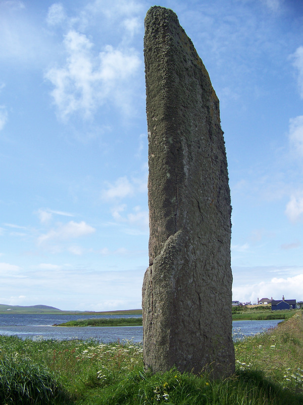 The Watch Stone standing stone stands guard by the Stenness Loch, Orkney Islands, Scotland, UK. Orkneyology.com