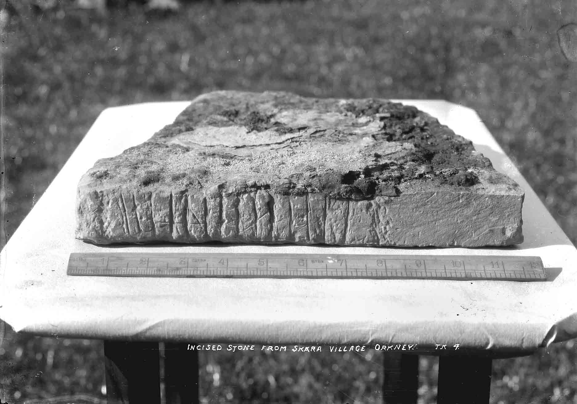 Decorated stone Old photo of the Gordon Childe archaeological dig of the Neolithic Village found on Skaill Beach, Sandwick, Orkney Islands, Scotland, UK. #Orkneyology.com